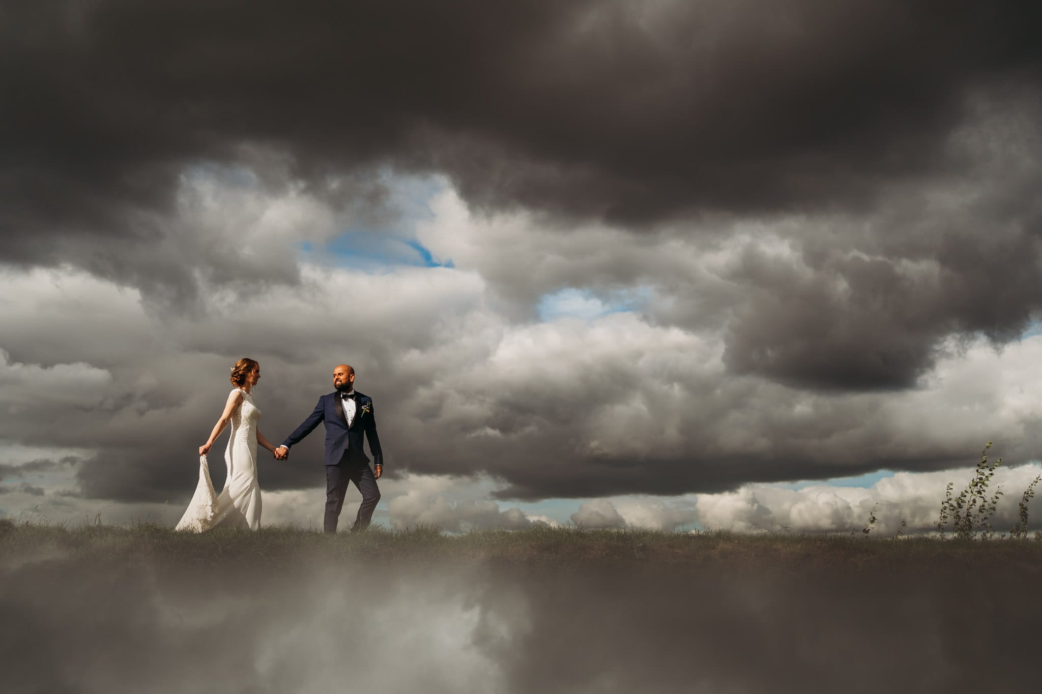 Bride & groom photograph with clouds above and below