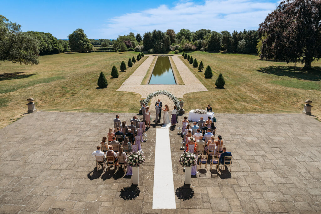 Outdoor wedding ceremony at Stubton Hall overlooking the gardens