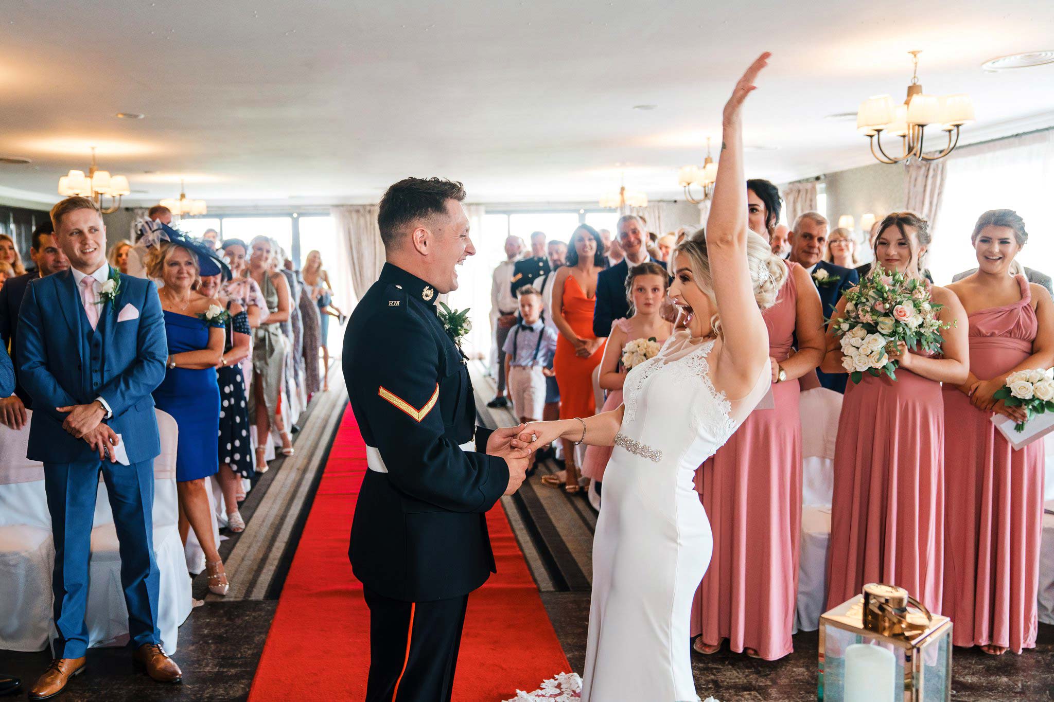 Bride cheers after getting married at the Nottinghamshire
