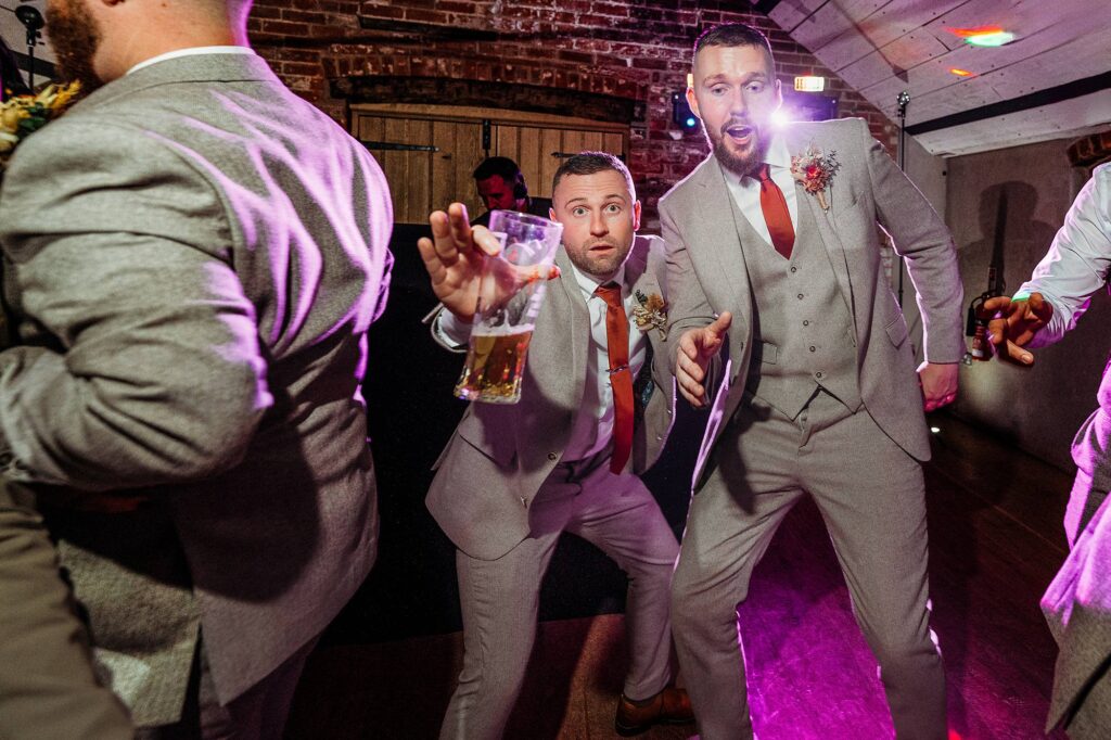 dancing groomsmen at a Derbyshire wedding at Grangefields