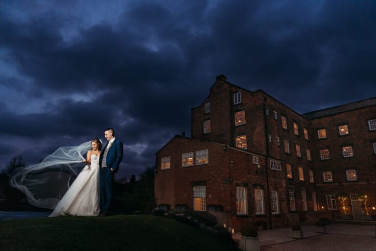 Bride at West Mill with Veil flowing in the wind at night