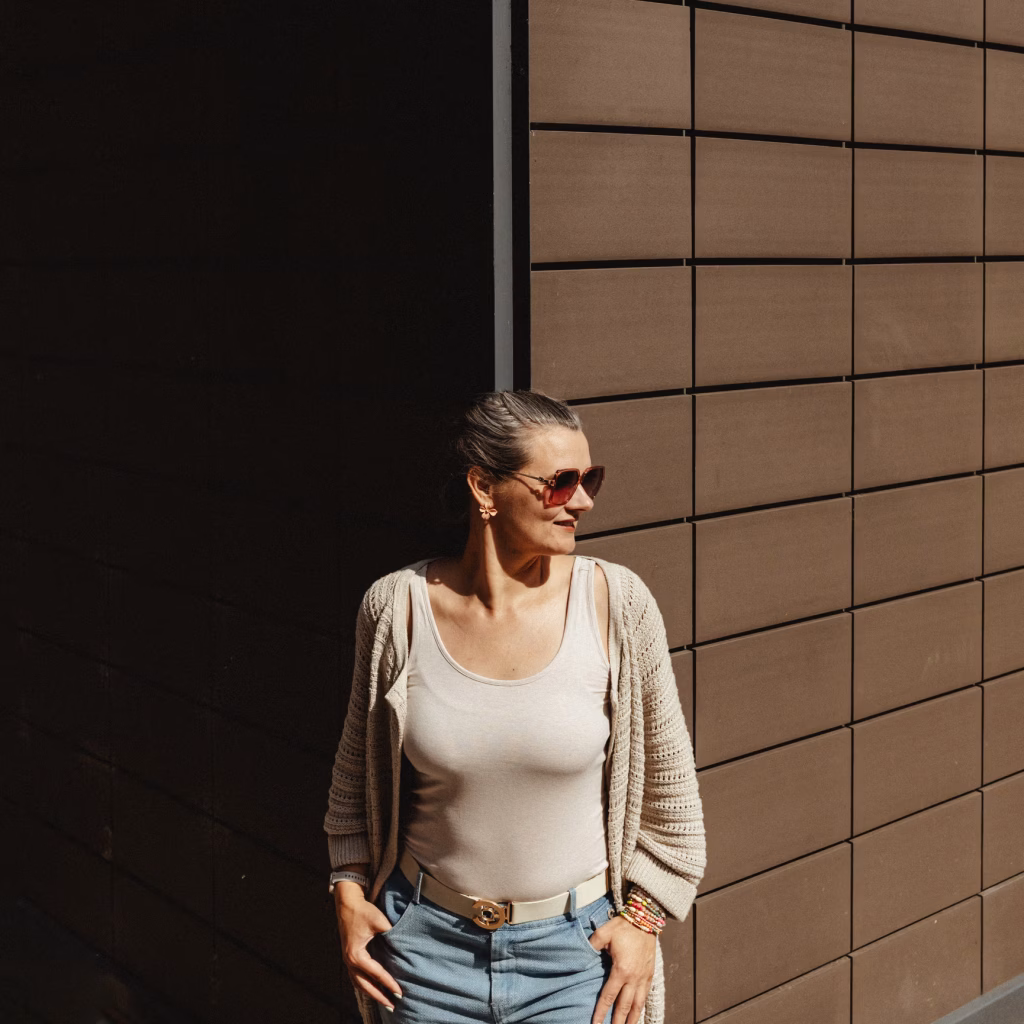 Daiga Cheung wearing sunglasses looking to the right